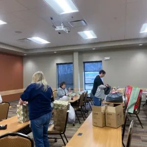 Team Members wrap gifts for DuraTech's annual Adopt a Family event.